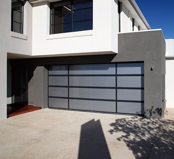 This is a Danmar Twinlite sectional garage door featuring a contemporary aluminium frame